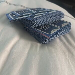 Set of over 100 marvel collectors items cards (4 cards per set).